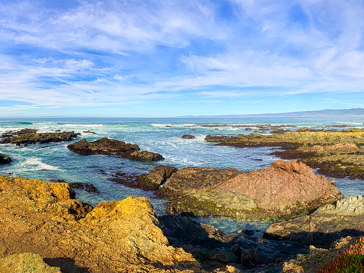 New Year's Resolutions Header - A beautiful, sunny day looking out to the ocean from Highway 1 with some rock features around the bottom of the picture.