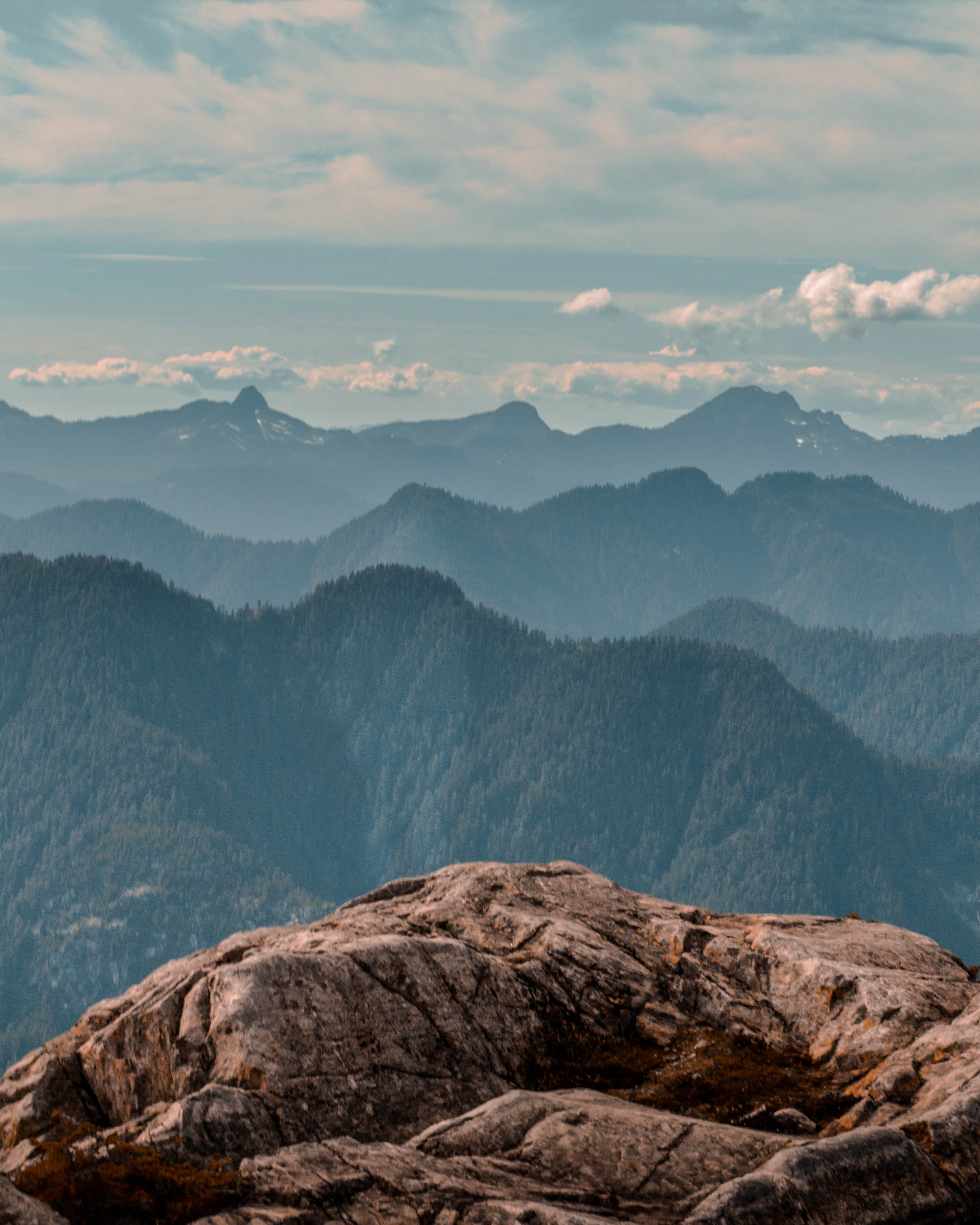 mountain top overlooking more mountain ridges