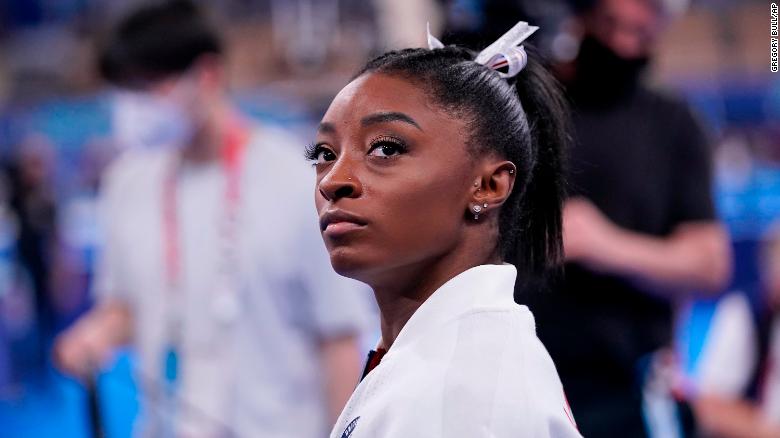 Simone Biles staring in the distance at the Tokyo Olympics